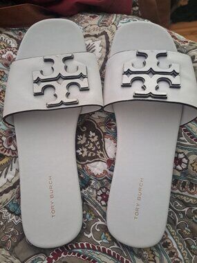 Tory Burch Ines Flat Slide sandals in Gardenia goat leather.